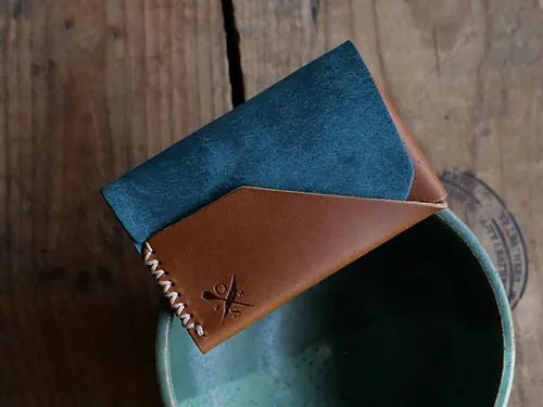 Who Owns Open Sea Leather Wallets